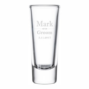 May include: Clear glass shot glass with the text "Mark Groom 5.11.2017" etched on the side.