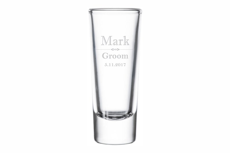 May include: Clear glass shot glass with the text "Mark Groom 5.11.2017" etched on the side.
