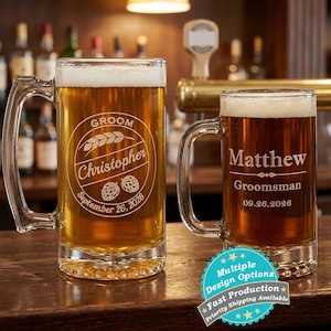 May include: Two glass beer mugs filled with beer. One mug is engraved with "Groom Christopher September 26, 2026". The other mug is engraved with "Matthew Groomsman 09.26.2026". The mugs have handles and are on a wooden surface.