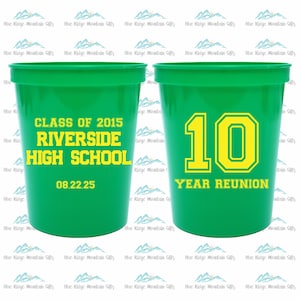 May include: Two green plastic cups with text printed on them. The left cup says "Class of 2015 Riverside High School 08.22.25". The right cup says "10 Year Reunion".