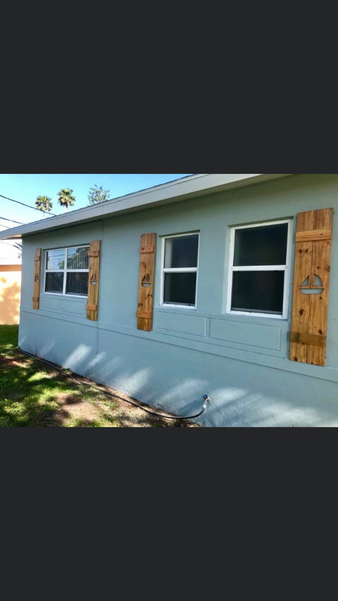 Solid wood exterior decorative window shutters with sail