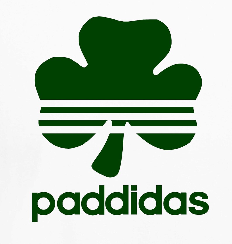 May include: A green shamrock with three white stripes across the center, with the word "paddidas" in green letters below.