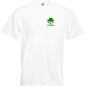 May include: White t-shirt with a green shamrock and the text "paddidas" printed on the front.