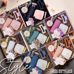 May include: Gift boxes in various colors, including blush, black, white, sage, lavender, terracotta, and moonlight. Each box contains a tumbler, jewelry case, scrunchie, hair clip, and lip balm. The word "Style" is written in cursive.