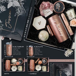 May include: A gift box set with a dark rose theme. The box is black with a white floral design and the text "Dark Rose Theme". The box contains a rose gold tumbler, a bath bomb, a candle, and a small dish. The box is available in two sizes: 25.4 x 25.4 x 7.6 cm and 22.9 x 15.2 x 7.6 cm.
