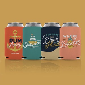 May include: Four colorful can coolers with different summer-themed designs. The designs include a gold anchor with the text "Let's Rum Away Together", a sailboat with the text "Let's Get Shipfaced", a wave with the text "Sun, Sand, and a Drink in my Hand", and a pineapple with the text "Where my Beaches at?"