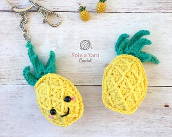 May include: Two crocheted pineapple keychains, one with a smiling face, and a pair of pineapple earrings. The keychains and earrings are yellow with green leaves. The text "Spin a Yarn Crochet" is visible in the image.