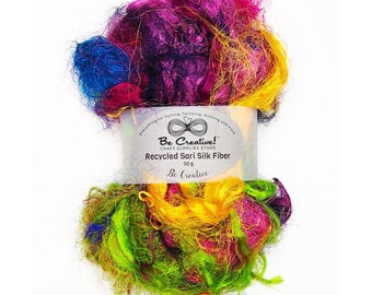May include: A bundle of colorful recycled sari silk fiber, perfect for felting, spinning, knitting, and more. The label reads "Be Creative!" Craft Supplies Store, Recycled Sari Silk Fiber, 50g, Be Creative.
