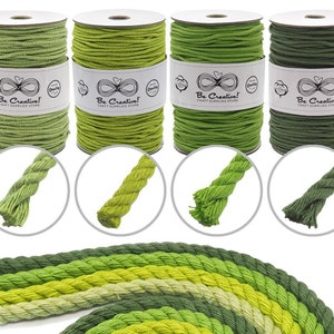 May include: Four spools of green cotton rope in different shades, from light to dark, with close-up samples of the rope's texture. Each spool has a label that reads "Be Creative! Craft Supplies Store."
