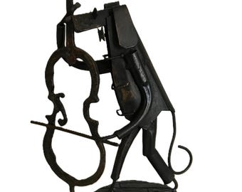 Vintage brutalist style metal dog playing Cello statue, welded metal dog playing musical instrument, contemporary style musical statue