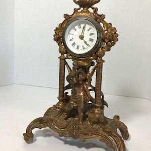 Vintage cast iron bronze mantle clock, Hollywood Regency ornate cherub mantle clock, Vintage German heavy iron gold elegant mantel clock