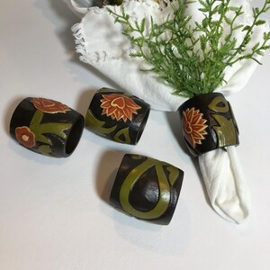 Vintage wood carved floral napkin holders, Vintage carved wood with green and orange carved floral design napkin rings, set of 4