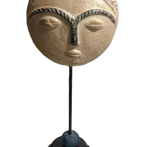 Vintage ceramic mask sculpture on stand, artisan clay face statue on metal base, terracotta art pottery face decor