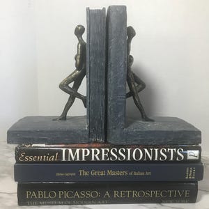Modern style bookends, contemporary stone look bookends with bronze figurine, unique stone finish modern bookend set