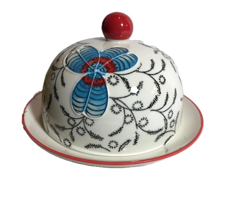 Anthropologie style Coastline Imports unique round butter dish, Ceramic black white with red and blue floral design cheese plate with cloche image 3