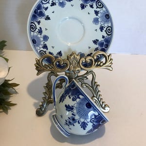 Vintage Delft blue and white porcelain cup and saucer, signed, Vintage Delft blue and white signed floral design teacup and under plate