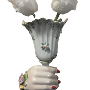 Vintage 60s porcelain delicate scalloped edge vase with hand around base.