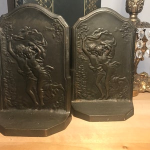 Antique cast iron bookends, Antique Connecticut Foundry Mfg Co 1928 bookends, Vintage cast iron The Storm art nouveau look figural bookends.