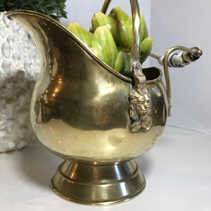 Vintage brass Dutch helmet scuttle bucket, Vtg aged brass coal bucket, Vtg brass pot porcelain handle and brass lion head details.