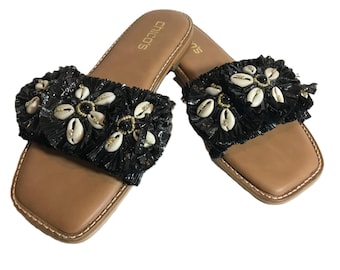 Black grass and seashell slip on sandals, Size 7M, Chicos black grass raffia open toe sandal with seashell and beading detail.