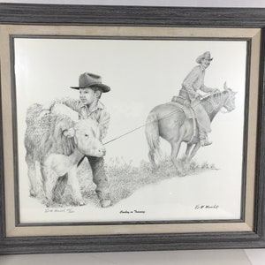 May include: A black and white pencil drawing of a cowboy on horseback and a young boy leading a calf. The drawing is titled "Cowboy in Training" and signed by the artist, L.M. Manzella.