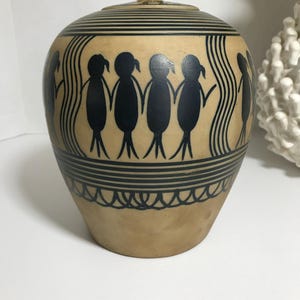 Unique hand painted folk art style ginger jar matte finish bold pattern lidded urn, black and tan painted people design pottery covered jar