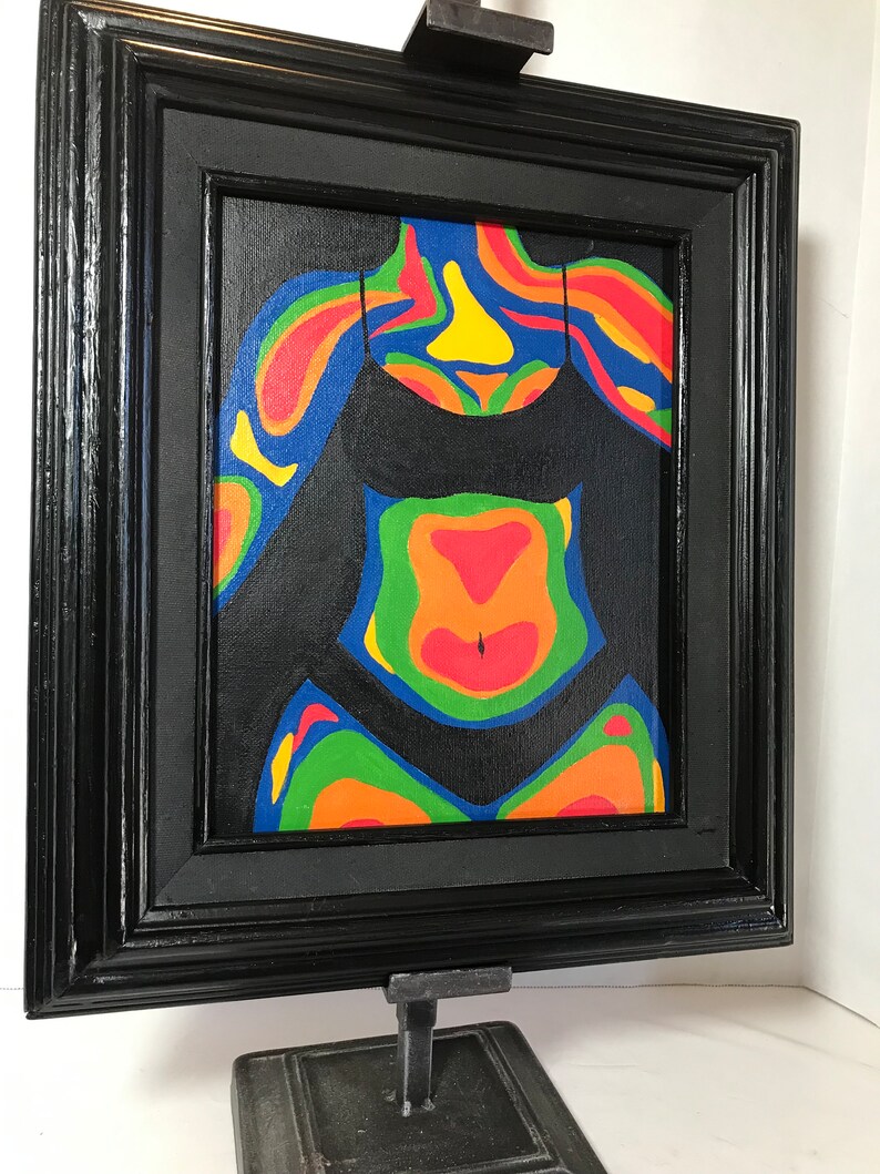 May include: A framed painting of a person's torso with colorful abstract patterns on a black background.