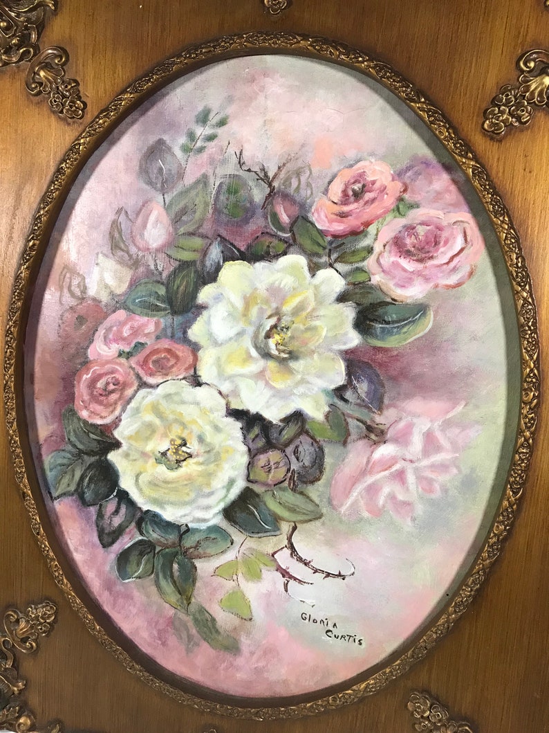 May include: A framed painting of a bouquet of white and pink roses with green leaves on a pink background. The painting is signed "Gloria Curtis".