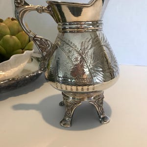 Vintage Meriden silver tall creamer pitcher, Meriden quadruple silverplate footed small engraved pitcher, Elegant silver creamer pitcher
