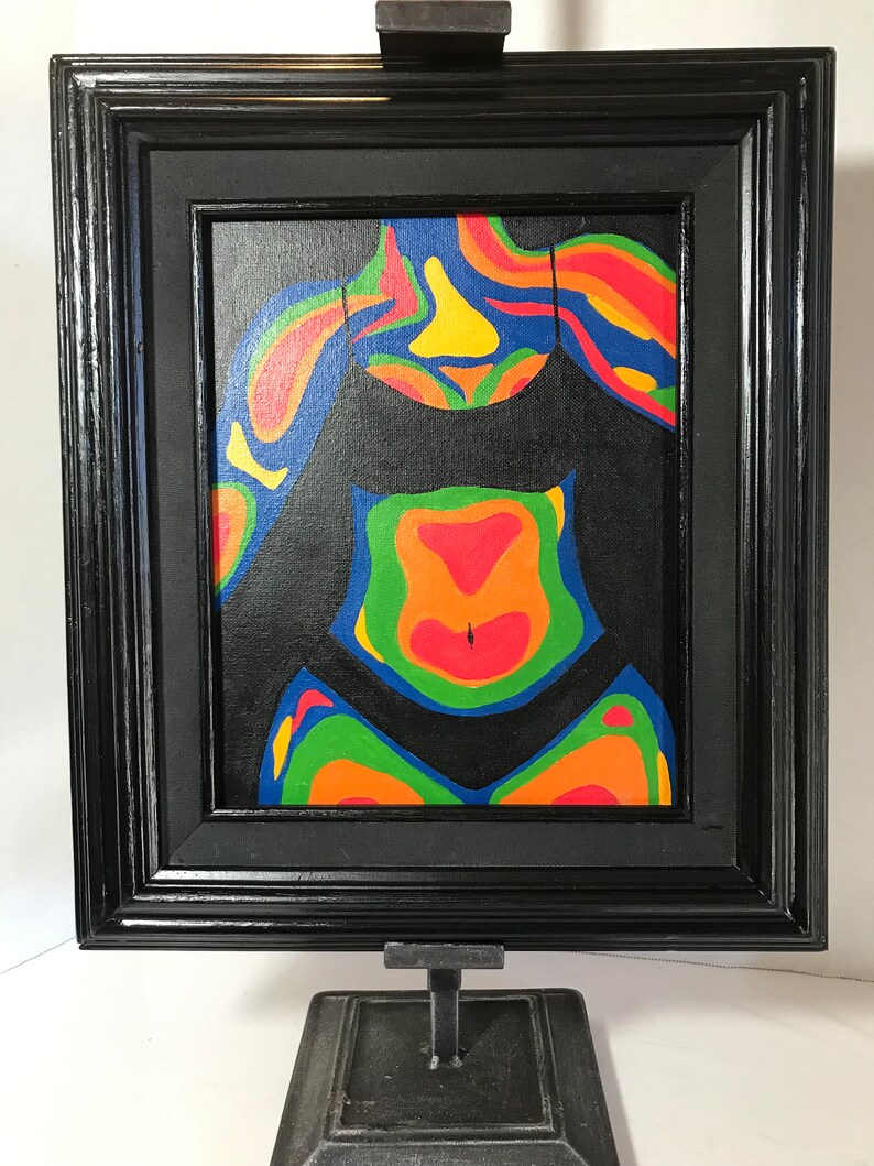 May include: A framed painting of a person's torso in a black swimsuit. The painting is done in a thermal imaging style, with colors ranging from blue to red.