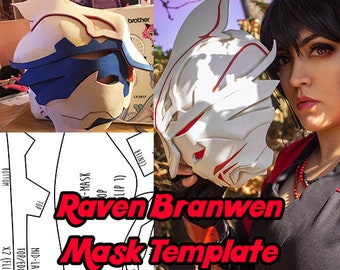 May include: A white and red Raven Branwen mask with a detailed design. The mask is held by a person. The image also includes a mask template with the text "Raven Branwen Mask Template".
