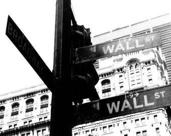 Wall St.: Black and white pedestrian perspective photograph; New York City