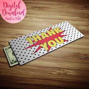 May include: A white envelope with black polka dots and a red and yellow comic book style "THANK YOU" graphic. The envelope is folded and has a five dollar bill sticking out of it.