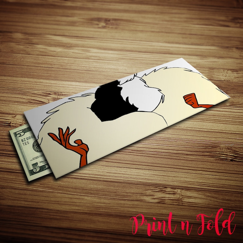 May include: A rectangular paper envelope featuring a stylized graphic illustration of a white and black creature with orange hands. The envelope is partially open, revealing a five-dollar bill tucked inside the left side of the paper container.