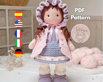 May include: A handmade crochet doll with brown hair, wearing a lavender bonnet, a pink jacket, and a blue dress. The doll has cream-colored leggings and lavender shoes. The image includes the text "PDF Pattern" and a logo.