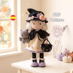 May include: A crocheted doll dressed as a witch, wearing a black hat with pastel flowers, a cream dress with small pumpkin motifs, and a black cape. The doll holds a small gray bat and a black cat-shaped basket, wearing light purple boots.