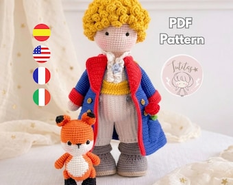 May include: A crochet doll of a boy with curly yellow hair, wearing a blue coat with red trim, a yellow sash, and white pants, standing next to a small orange and white crochet fox. The text PDF Pattern is visible in the upper right corner.