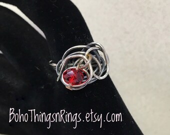 Boho squiggle ring with red floating bead