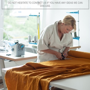 May include: A woman is cutting a large piece of mustard yellow fabric with scissors. The fabric is laid out on a table in a workshop setting. The text above reads: "WE GLADLY ACCEPT CUSTOM ORDERS FOR ANY SIZE OR DESIGN AND MORE THAN 40 COLORS. DO NOT HESITATE TO CONTACT US IF YOU HAVE ANY IDEAS WE CAN DISCUSS."