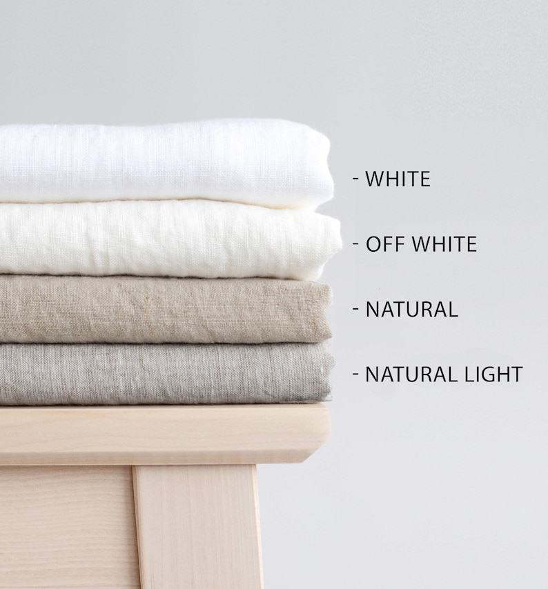May include: Four linen fabric swatches stacked on top of each other. The swatches are in the following order from top to bottom: white, off-white, natural, and natural light.