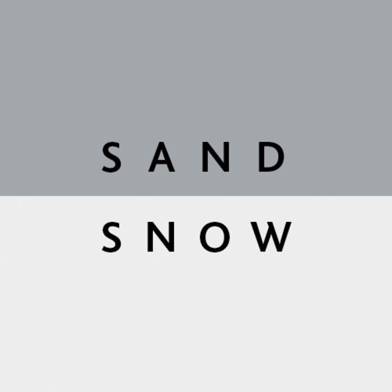 May include: A minimalist graphic design featuring the words "SAND" and "SNOW" in black, sans-serif font. The text is set against a two-tone background, with a gray upper section and a white lower section.