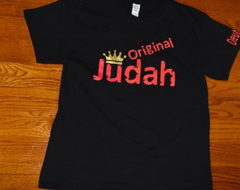 May include: Black t-shirt with a red and gold design that says "Original Judah" with a crown above the word "Judah".
