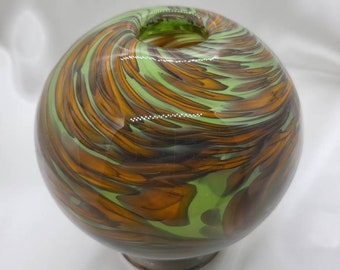 Unique globe shaped hand-blown vase with beautiful brown and light seafoam green swirls