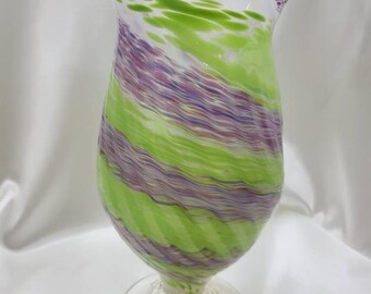 Spiral swirl light green with pink, purple,  and blue over a white background  hand-blown glass vase