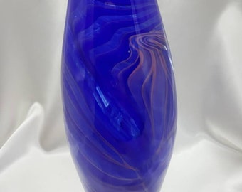 Gorgeous rich, royal blue vase with orange swirl accents hand-blown glass