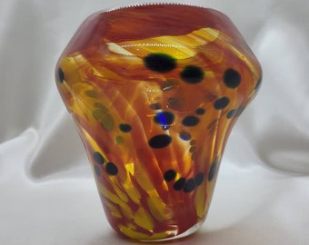 Fiery hand-blown glass vase with deep blue spots
