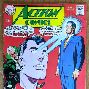 May include: A comic book cover featuring Superman with a red, blue, and yellow costume. The cover features the text "Action Comics" and "Head of Hate!" The cover also features a man in a blue suit with a yellow tie and glasses.