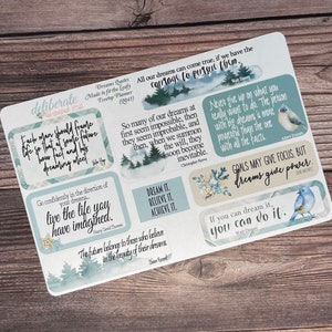 May include: A set of eight motivational quote stickers with watercolor backgrounds and illustrations of birds. The quotes include: "Each man should frame life so that of some future how fact and his dreaming meet", "Go confidently in the direction of your dreams... live the life you have imagined", "All our dreams can come true, if we have the courage to pursue them", "So many of our dreams at first seem impossible, then they seem improbable, and then, when we summon the will, they soon become inevitable", "Dream it. Believe it. Achieve it.", "Never give up on what you really want to do. The person with big dreams is more powerful than the one with all the facts", "Goals may give focus, but dreams guide power", "If you can dream it, you can do it."