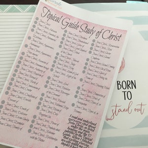 May include: A pink and white printable checklist with the title "Topical Guide Study of Christ". The checklist includes a list of topics related to Jesus Christ, such as "Jesus Christ, Advocate", "Jesus Christ, Authority of", and "Jesus Christ, Birth of". The checklist is designed to help people study the life and teachings of Jesus Christ.