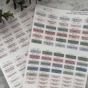 May include: Two sheets of stickers with text labels for the 2026 Come Follow Me curriculum. The labels are in various colors, including pink, green, and blue, and are organized by date and topic.